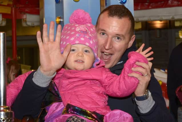 Brian Donaghy and daughter Erin wave to the camera. INBL1544-233EB