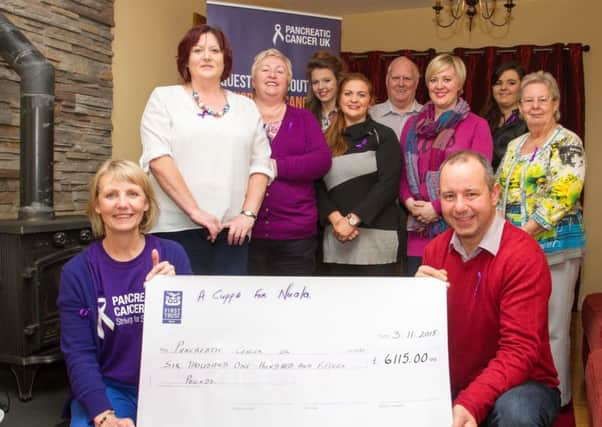 Michelle Penney (Community Involvement Coordinator with Pancreatic Cancer UK), accepted a cheque for £6,115 on behalf of the charity. Nuala's husband Frankie, daughters Aoife and Anna, her parents Irene and Ignatius and her friends Denise, Edel, Michelle, and Marian and the entire Hughes and Corr families would like to sincerely thank the people from our community who attended and donated. Photo by Oliver Corr