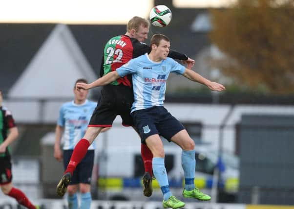 Ballymena's Leroy Millar in action with Glentoran's Steven Gordon during Saturday's match at the Showgrounds. Picture: Press Eye.