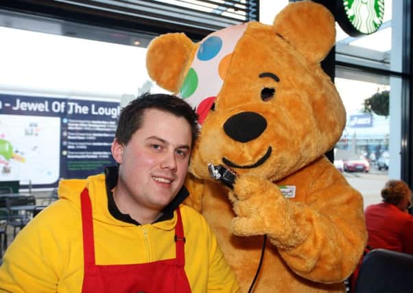 Steve Caldwell, from Starbucks at Junction One, pictured with Pudsey prior to having his head shaved to raise money for Children in Need. INAT47-407AC