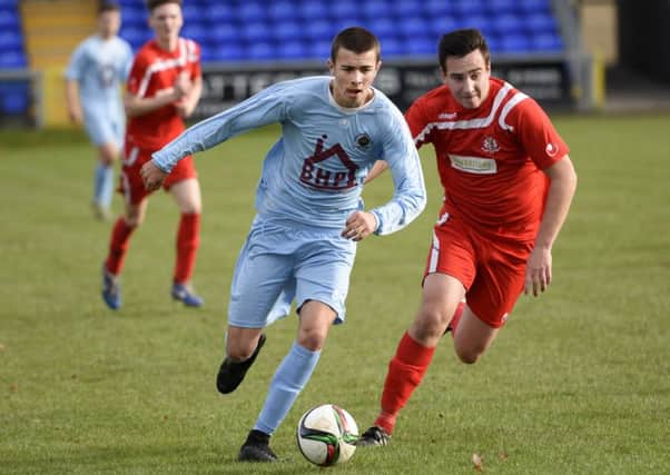 Alex Pomeroy powers forward for Institute Colts during Saturday's match against Portadown III's. INLS4515-116KM
