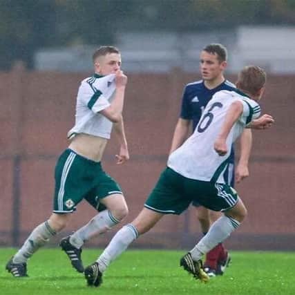 Jack Chambers kisses the Northern Ireland badge after scoring his first goal for his country's U16s in the 1-0 Victory Shield win over Scotland last week.