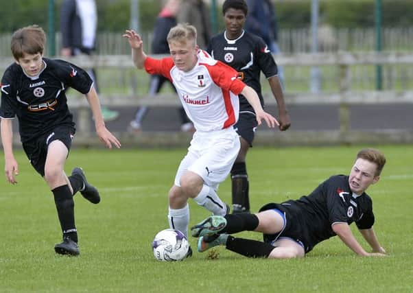 Darragh Gray sliding in on duty for County Armagh in the Milk Cup. Pic by PressEye Ltd.