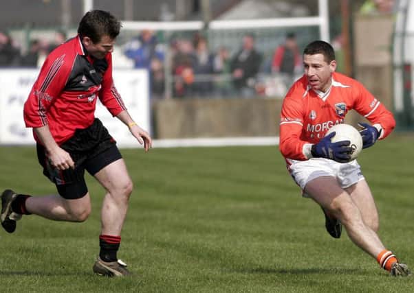 Diarmuid Marsden (right) on show for Armagh during his playing days.