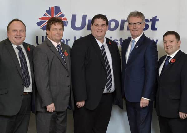 Councillor David Arthurs (centre) is welcomed back into the UUP by, from left, Adrian Cochrane-Watson MLA, Alderman Mark Cosgrove, party leader Mike Nesbitt MLA and Robin Swann MLA. INNT 46-533CON