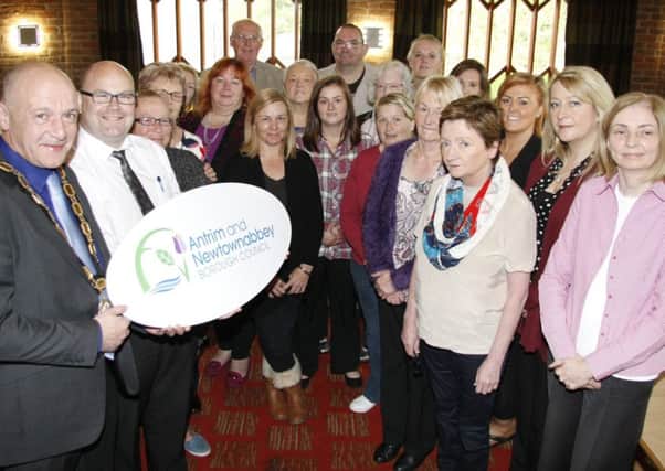Deputy Mayor, Councillor John Blair, accompanied by elected members, council officers and community group members from Antrim and Newtownabbey at the community connections breakfast. INNT 46-810CON