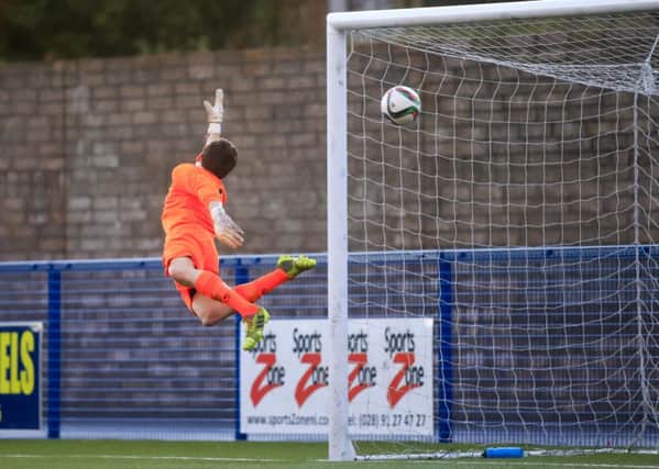 Institute goalkeeper Michael Lynch pictured at full stretch but he was unable to keep out Bangor's Mark Cooling free-kick. Picture by Kevin Scott/Presseye