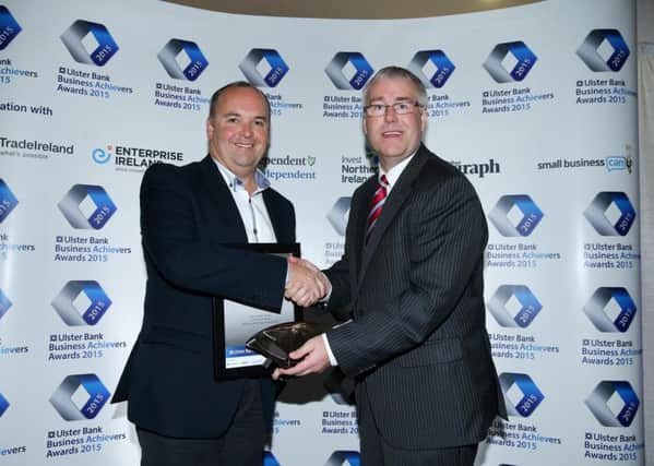 Collecting the 2015 Ulster Bank Business Achievers Award for Business Start Up is Alan Lowry from Environmental Street Furniture. Alan received the award from Richard Donnan, Ulster Bank's Head of Northern Ireland. INNT 46-529CON