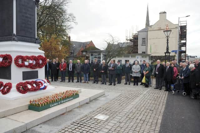 Jonathan Craig MLA (who deputised for the Lisburn Branch Chaplain) pictured reading a portion of Scripture and leading prayers during a short act of remembrance at an Armistice Day Ceremony at Lisburn War Memorial on Wednesday 11th November at 11am (the 11th hour, of the 11th Day of the 11th Month).  Included are Raymond Corbett (President of Lisburn Branch of the Royal British Legion) and Gordon Rogan (Secretary of Lisburn Branch of the Royal British Legion) who gave the exhortation.