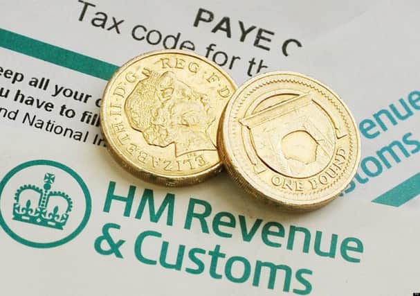 File photo dated 18/03/13 of a general view of pound coins on HM Revenue & Customs forms as billions of pounds of taxpayers' money is being lost because of the failure of HM Revenue and Customs to clamp down effectively on fraud and error, MPs warned today. PRESS ASSOCIATION Photo. Issue date: Tuesday May 21, 2013. The Commons Public Accounts Committee said HMRC was set to achieve less than half the projected savings from reducing fraud and error in the payment of tax credits. The 2010 spending review set HMRC a target of saving £8 billion by 2015, but the committee said that it now estimated it would miss its goal by £5 billion. See PA story POLITICS Fraud. Photo credit should read: Rui Vieira/PA Wire