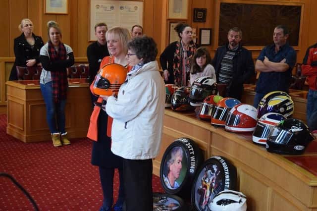 Mayor of Causeway Coast and Glens Borough Council Michelle Knight-McQuillan receives the collection from the McCook family.,