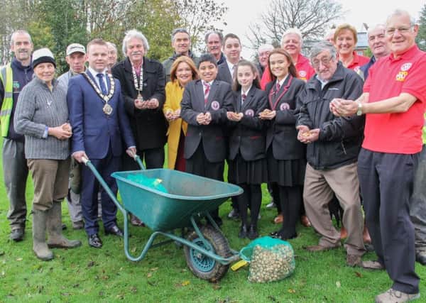 Mayor Thomas Hogg joined Leonard Sproule, President of the Rotary Club of Newtownabbey, staff and pupils from Abbey Community College, Rotary Club members, council workers and volunteers from Ballyearl Allotments for the crocus bulb planting event at Ballyearl, part of Rotary's work in support of the international End Polio Now Campaign.  INNT 46-513-SO