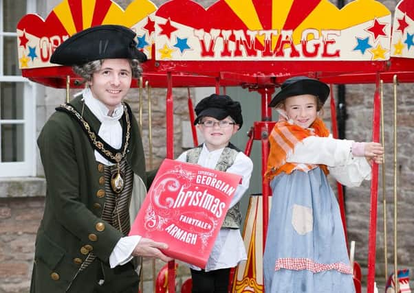 Lord Mayor of Armagh, Banbridge and Craigavon, Darryn Causby is joined by J.P. Donnelly (5) and Tara Brennan (6) in inviting everyone to come and celebrate the wonder of Armaghâ¬"s annual Georgian Day on Saturday, November 28.