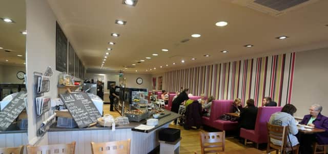 The bright, spacious interior of Caffe Tosca. INBT 47-126JC