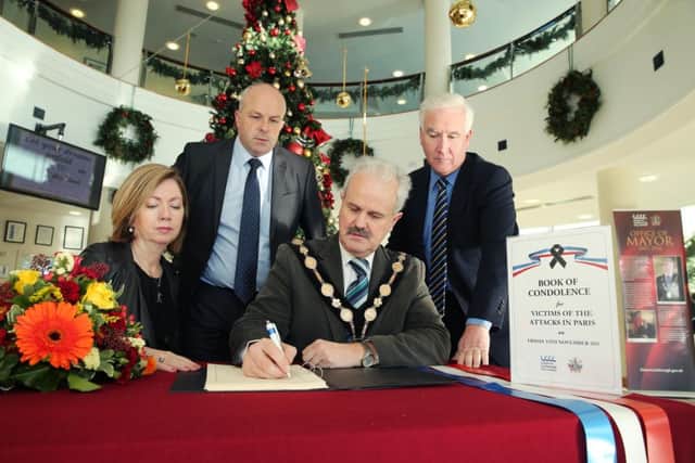 PRESS RELEASE IMAGE 

Press Eye - Belfast - Northern Ireland - 16th November 2015 - 

Lisburn & Castlereagh City Council opened its Books of Condolence for Victims of the Paris Attacks today across Council facilities.  Pictured at Lagan Valley Island, signing the Books of Condolence is (l-r) Alderman James Tinsley, Chairman of the Councilâ¬"s Corporate Services Committee; Dr Theresa Donaldson, Chief Executive; the Mayor, Councillor Thomas Beckett and Adrian Donaldson, Director of Corporate Services.

Picture by Kelvin Boyes / Press Eye.