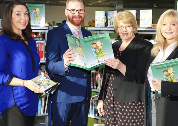 Health Minister Simon Hamilton joins Irene Knox of Libraries NI and Brenda Hale MLA to welcome children's grief awareness materials into libraries from Beverley Brown of Funeral Services Northern Ireland