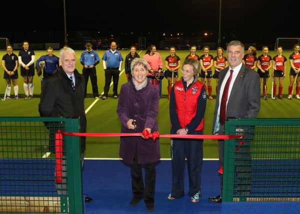 Former Ireland international and Great Britain Player of the Year Margaret Gleghorne cuts a ribbon to mark the official opening of the new hockey pitch which is names after her. Included is Head of PE at Ballymena Academy Diane McNeil, school principal Mrs Stephen Black (left) and chairman of the Board of Governors James McKervill. INBT 47-191CSl