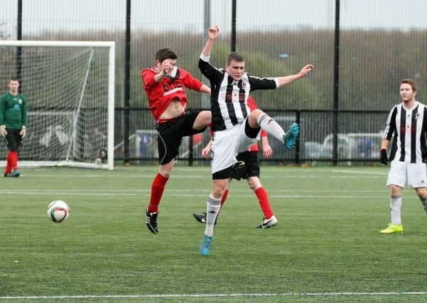 Wakehurst Strollers and Whiteabbey players battle for possession in Saturday's Canada Trophy tie.