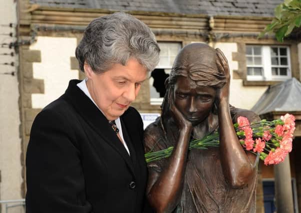 Claudy bomb anniversary Picture Gavan Caldwell
see story Michael McGlade.
Mary Hamilton remembering the bomb victims
at the Claudy memorial.