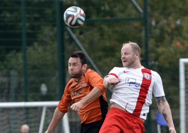 Lee Wells (left) on show for Tandragee Rovers against Banbridge Rangers. Pic by Paul Byrne.
