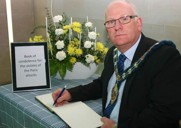 The Mayor of Mid and East Antrim Borough, Councillor Billy Ashe signs Books of Condolence for the victims of the terrorist attacks in Paris.