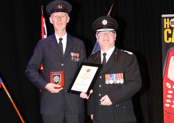 Noel McKee (left), who was awarded the Chief Fire & Rescue Officer Award at the NIFRS Employee Awards 2015 with  Dale Ashford, interim Chief Fire & Rescue Officer. INCT 46-792-CON