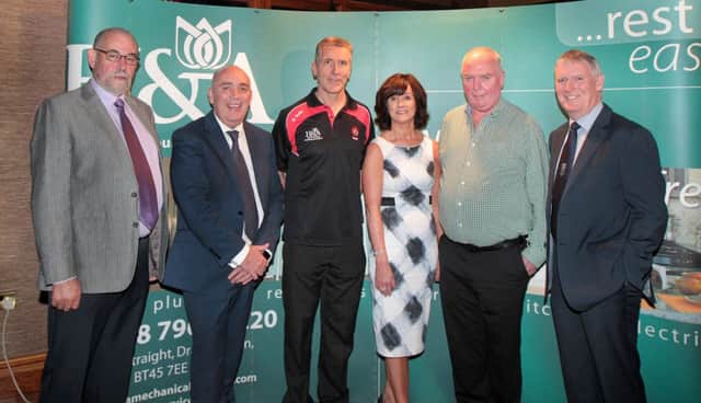 Derry  Senior Football manager Damian Barton together Hugh and Anne McWilliams of H&A Mechanical Services Ltd who are the new sponsors of Derry inter-county football and hurling teams at minor, u21 and senior levels, Brian Smith,chairman of Derry GAA, Kieran Kennedy of O'Neills and John Bosco O'Hagan of outgoing county sponsors Specialist Joinery.  (Picture Margaret McLaughlin)