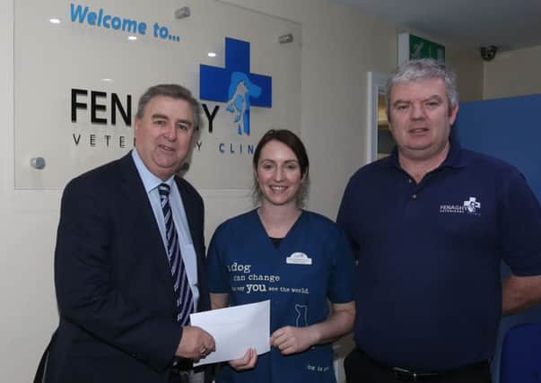 Zara Gaston, of Fenaghy Veterinary Clinic, presents sponsorship for the Ballymena United v Coleraine JBE League Cup quarter final at Ballymena Showgrounds on Wednesday to Brian Thompson, of Ballymena United FC. Included is Fenaghy Veterinary Clinic proprietor Andy Hillan. INBT 47-125JC