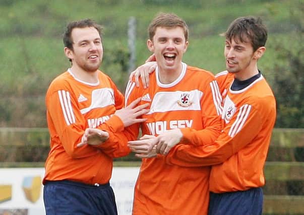David Taylor (centre) celebrates with Broomhill team-mates, from left, Jason Harper and Ben Steen.
