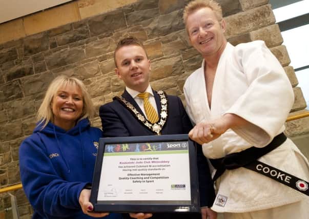 Mayor of Antrim and Newtownabbey, Councillor Thomas Hogg, presents Jonathan and Wendy Cooke of Kootateki with their certificate. INLT 47-945-CON