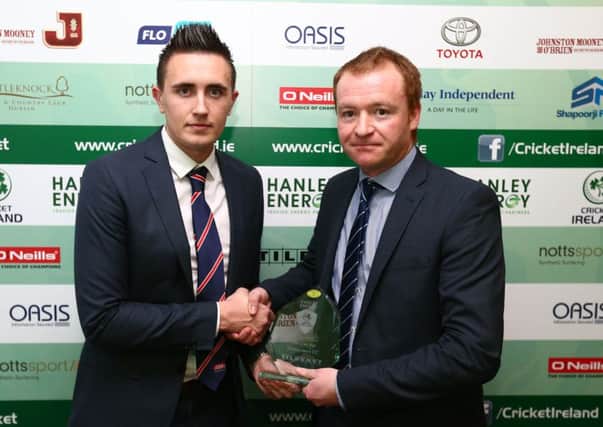 Lee Nelson accepts the award for Tildenet Club of the Year on behalf of Waringstown Cricket Club from Richard Jones, Commercial Sales Manager Tildenet, at the 2015 Hanley Energy Cricket Ireland Awards.