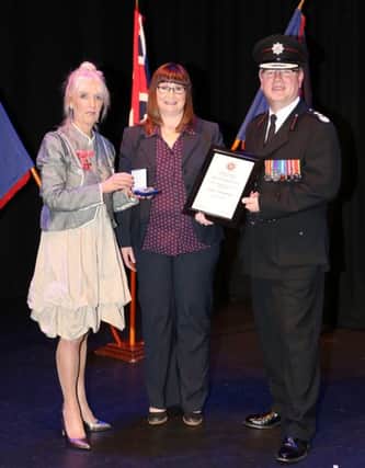 Interim Chief Fire and Rescue Officer, Dale Ashford, Jackie Childs with
Carmel McKinney, Chairperson of the NIFRS Board