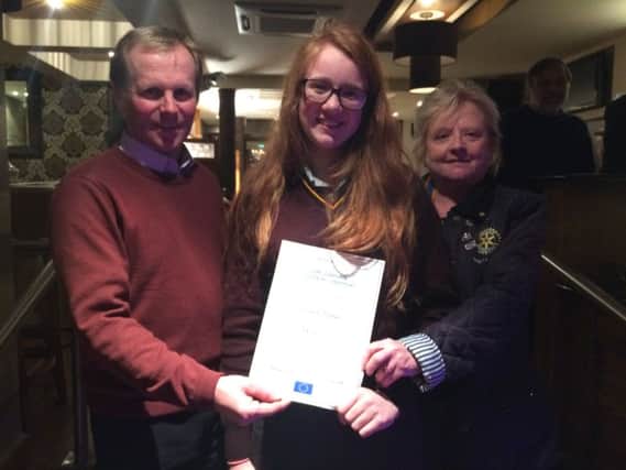 Ballycastle Rotary Youth Chair, Malcolm Rankin and President Brenda Caher congratulating Club winner Luiseach.