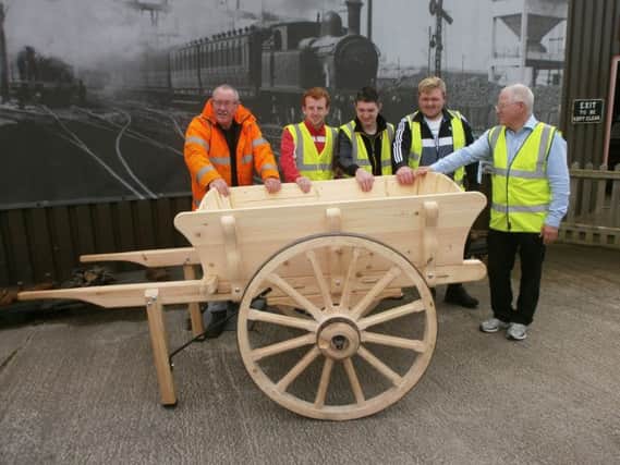 Downpatrick and County Down railway Carriage and Wagon officer Dave Smith, Patrick OHare and SERC joinery students Chris Ferguson, Michael Adams and Tony Allen from Lisburn with the 1911 vintage handcart at its unveiling at the Downpatrick and County Down railway.