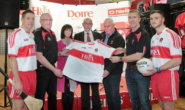 The new Derry GAA Jersey launch at O'Neills in Magherafelt on Wednesday night. Included are senior hurler Sean McCullagh, Tom McLean, senior hurling manager, Anne McWilliams,sponsor, Brian Smith,county chairman, Hugh McWilliams,sponsor, Damian Barton,senior football manager and senior footballer Daniel McKinless. (Picture Margaret McLaughlin)