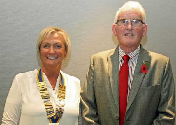 Brenda Houston, president of Carrickfergus Rotary Club, with Sydney Johnston on his return from India. INCT 47-701-CON