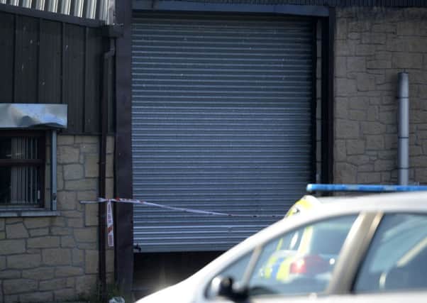 Police at the alleged murder scene on the Moor Road area of Coalisland in October. 


Photo Colm Lenaghan/Pacemaker Press
