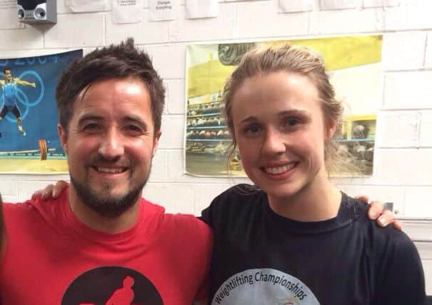 Weight-lifting coach Timmy Graham with Emma Alderdice.