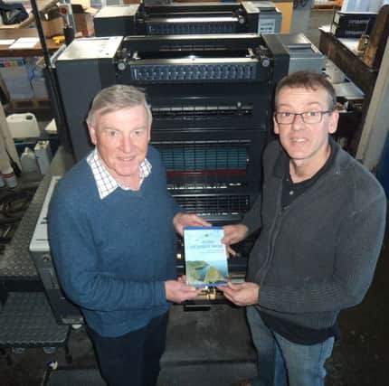 James Wilkinson with Paul Kane of Impact Printing, who produced the publication.