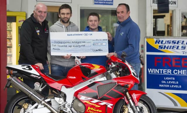 The road racing season may be on hiatus for the winter but the hard work continues behind the scenes as Russell Shiels Tyres Ltd has been busy raising more than £2,000 towards the cost of replacing the Joey Dunlop grandstand at the start/finish line of the famous Ulster Grand Prix circuit in Dundrod.

Owner of the Magherafelt business Russell Shiels, who is a long-time road racing fan, produced and sold 1,000 car air fresheners that replicate Joey Dunlops iconic yellow Arai helmet to raise the funds.

Pictured receiving the cheque is Noel Johnston, Clerk of the Course at the Ulster Grand Prix with William Dunlop, Joey's son Gary Dunlop and Russell Sheils.