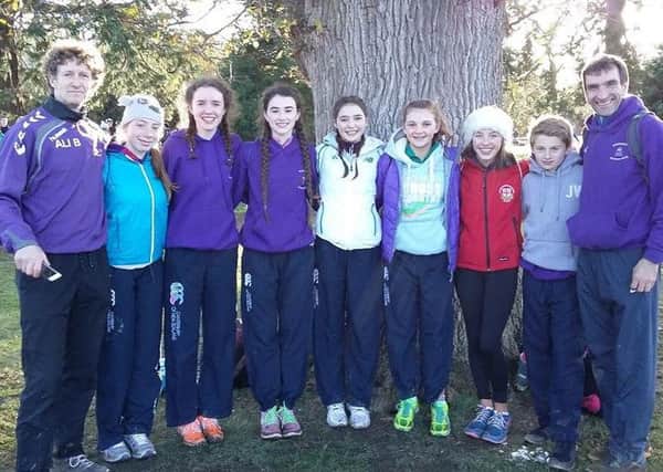 Springwell Juniors who competed in the GloHealth Irish Junior Even XC Championships at Santry along with coaches Philip Tweedie and Ali Bratten