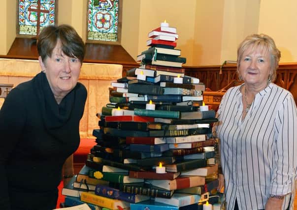 Rosemary Frayne and Anne Kee with the bible Christmas tree for the Christmas Tree Festival, held at St Collmanell's Church from 26th November to the 1st December. INBT 47-808H