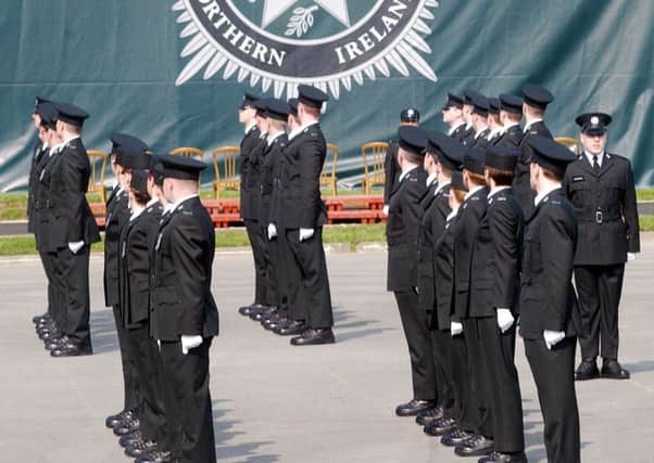 PACEMAKER, BELFAST, 5/4/2002: The new recruits of the Police Service of Northern Ireland march past the new PSNI logo during the first ever graduation ceremony in Belfast today.
PICTURE BY STEPHEN DAVISON