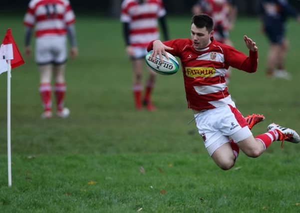 Randalstown full-back M Smith makes a spectacular dives as he goes over in the corner during Saturday's league game with Grosvenor at Neillsbrook. However it was all in vain as play was called back after the referee adjudged that the pass to se up the score was forward.  INBT 48-374CS