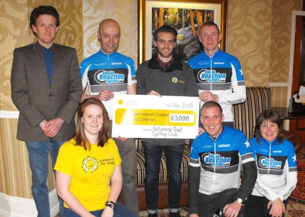 Louise Montgomery and Andrew Boal, from the Cancer Fund for Children, receive a cheque for £3,000 - the proceeds of the Billy Kerr Sportive during the summer - from Ballymena Road Club members Geoff Allen, Hazel Hughes, Nigel Kernohan, Neil Kerr and John McKillop.