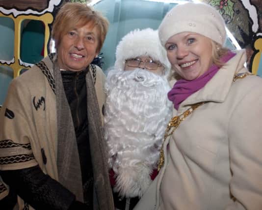 DEAR SANTA...Mayor Cllr Michelle Knight-McQuillan and Chamber of Commerce President, Winifred Mellett, pictured with Santa Claus at the Switch On in Ballymoney on Thurs night.INBM48-15 014SC.