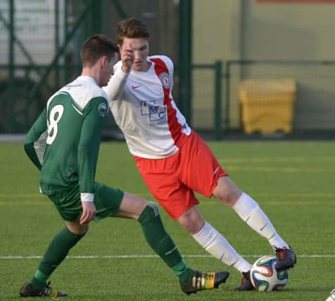 Colin Cunningham takes on a defender during a recent game at Cheney Park. INBL1547-228PB