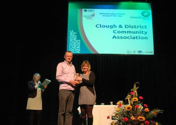 Deborah Neill presenting the East Rural Community Cluster Award to Clough Community-Association. INBT 48- COMMUNITY CLUSTER 1.