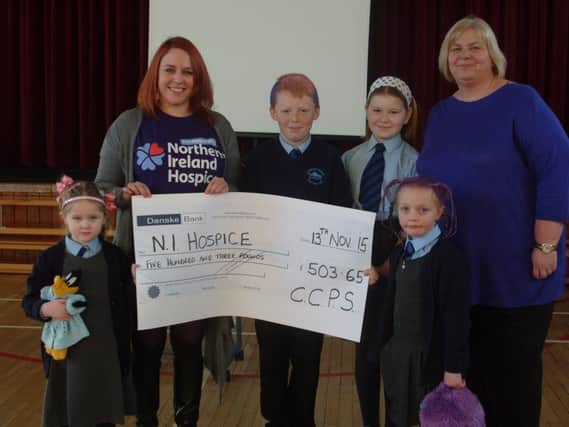 Central Primary School pupils Lucy Ashe, Bradley Foster, Carla Brown and Olivia Johnston present a cheque for £503.65 to Cailin Hardy, from Northern Ireland Hospice, included is principal Nuala Hall. INCT 47-755-CON