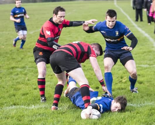 Lisburn touch down for a try during their match against Carrick.